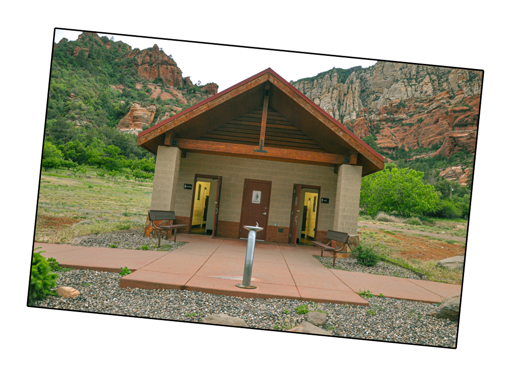 Wooden outhouse that is isolated in the Oak Creek Canyon